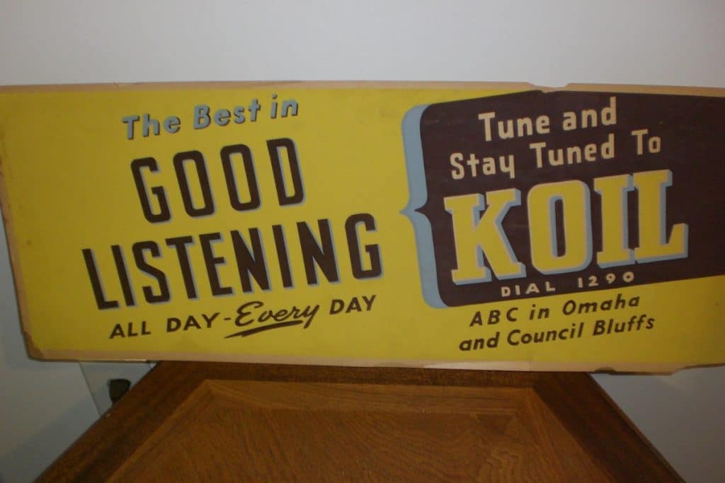 Side 2 of radio station KOIL cardboard sign